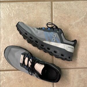 On Cloud Gray, Pink, and Black Athletic Shoes